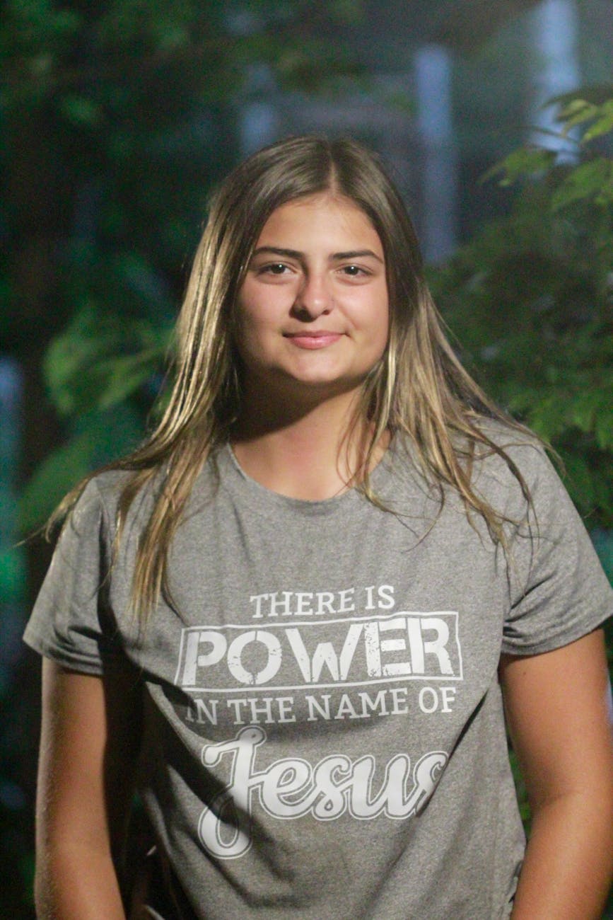 smiling woman in inspirational t shirt outdoors