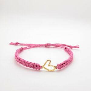 Gold heart charm bracelet on natural hemp cord symbolizing being rooted in God’s love.