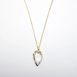 Gold arrowhead clear quartz pendant necklace on delicate gold chain against white background