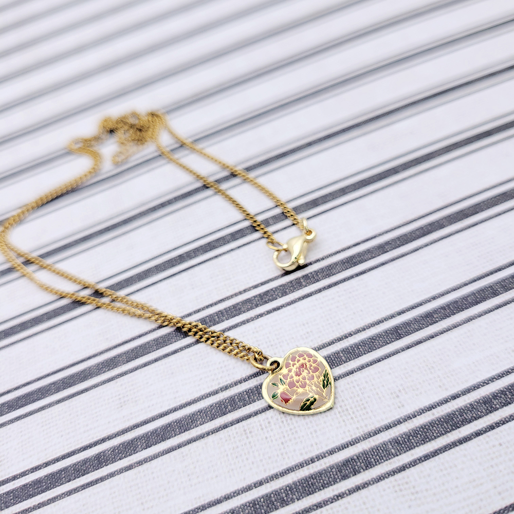 vintage floral cloisonné heart pendant necklace gold chain flat lay detail