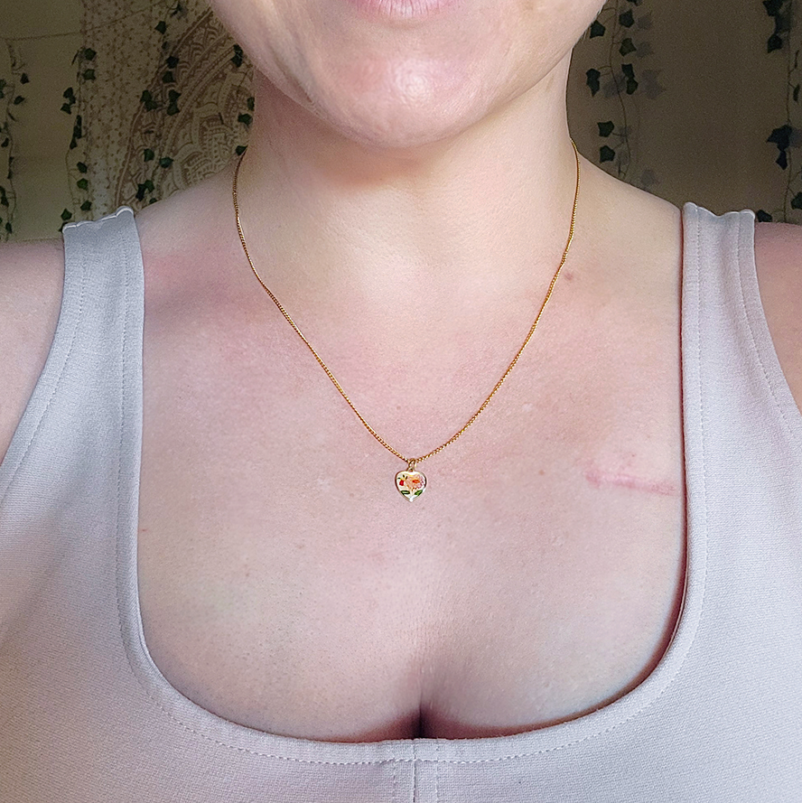 gold cloisonné heart necklace worn on 18 inch gold curb chain lifestyle photo