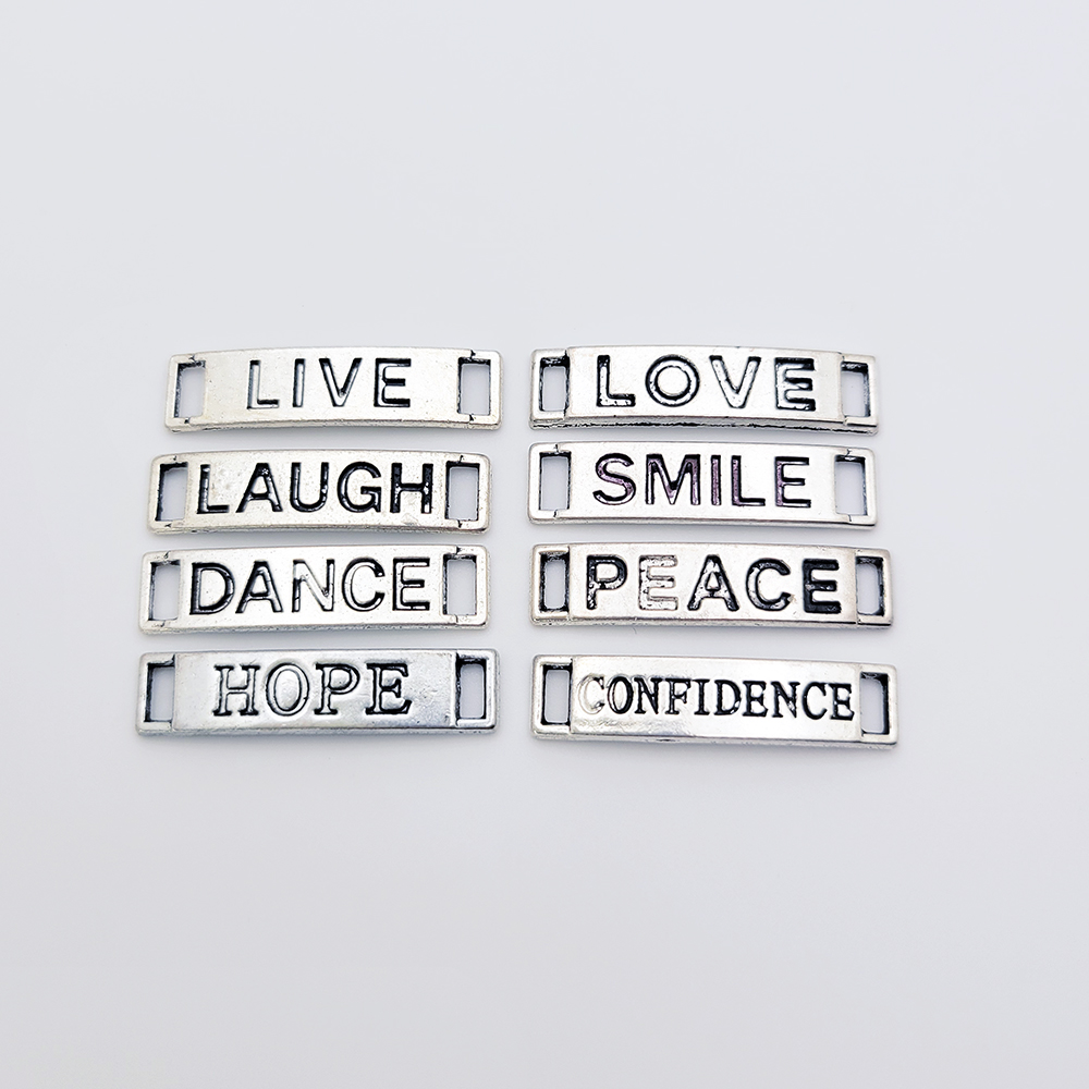 Inspirational word charms for handmade bracelets including Confidence, Hope, Peace, Love, Smile, Dance, Live, and Laugh.