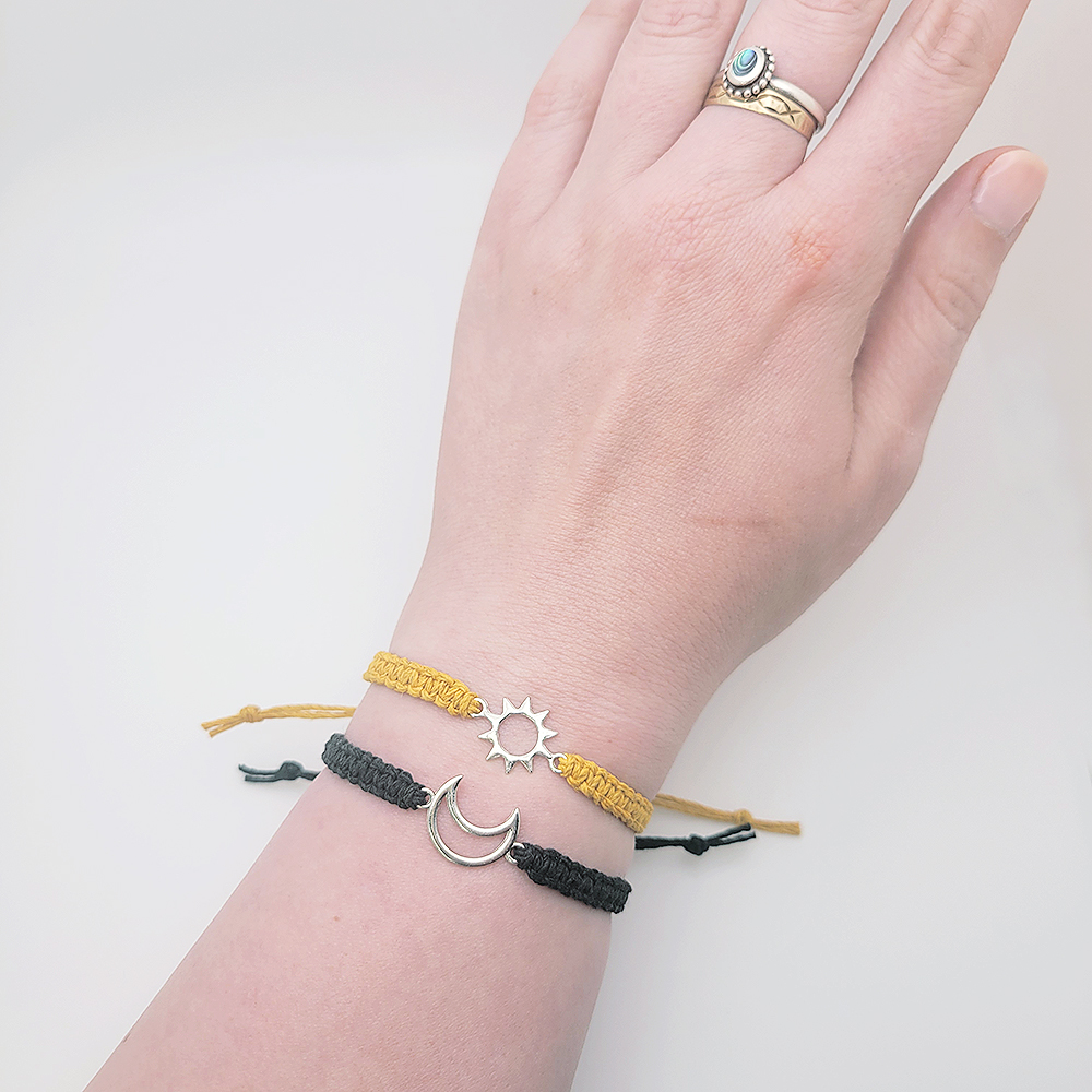 Sun and moon hemp cord bracelets worn together on wrist, adjustable faith bracelets in mustard yellow and black