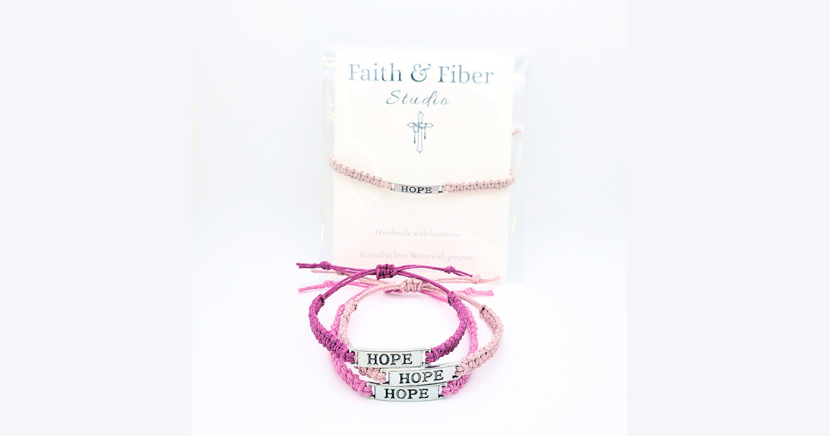 Handmade pink “Hope” bracelet set by Faith & Fiber Studio for breast cancer support, featuring braided cord and silver HOPE charm